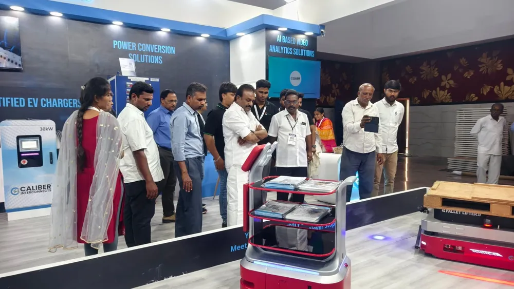 Visitors inspecting equipment at the Caliber power solutions stand