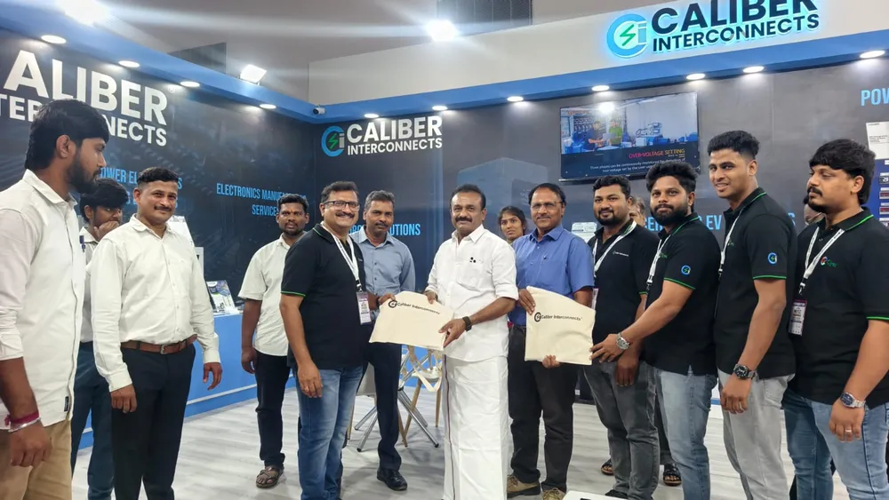 Exhibitor team posing with recognition certificates
