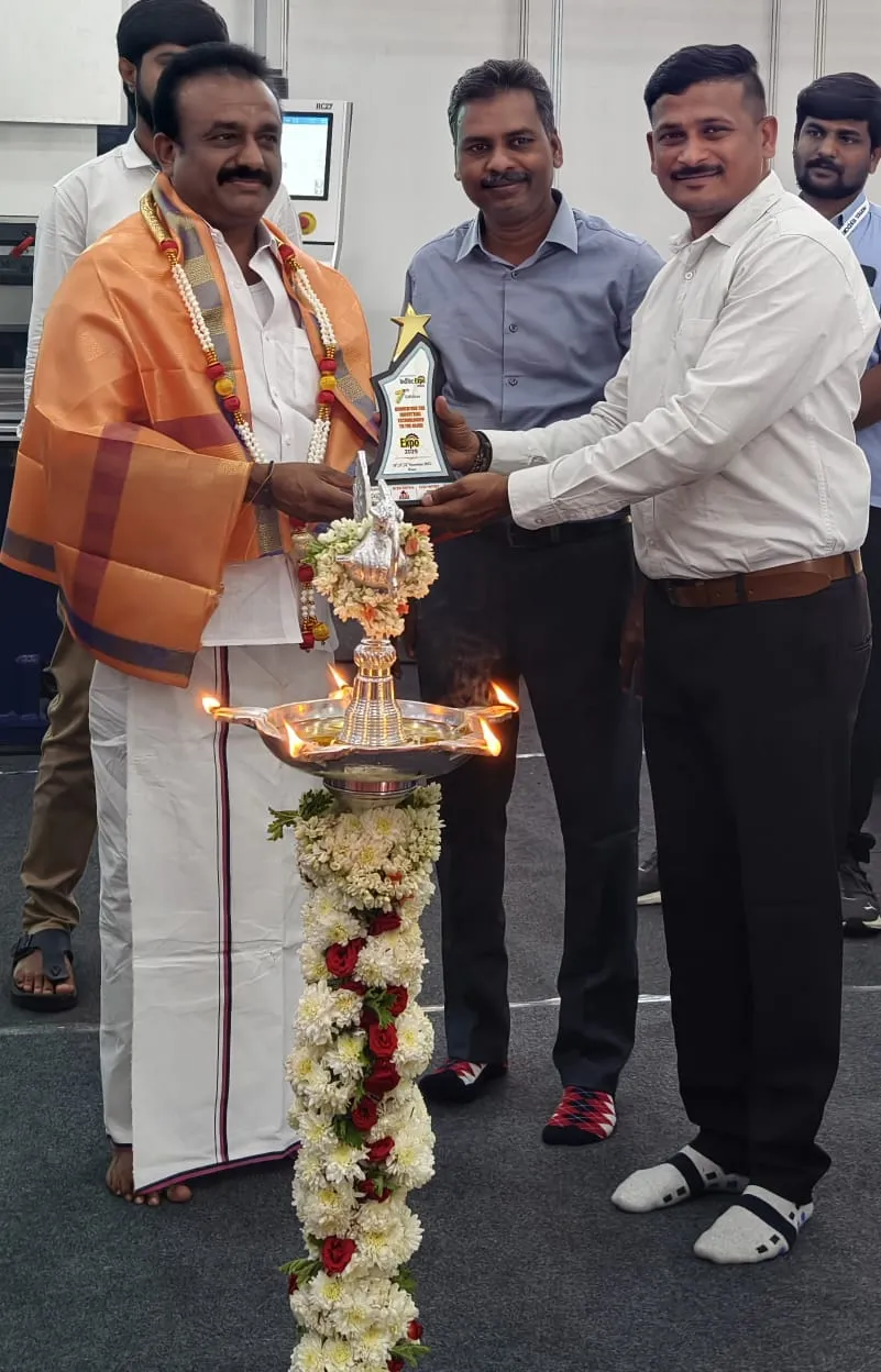 Traditional lamp being lit during the inauguration ceremony